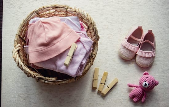 children's things in the basket. washing children's clothes