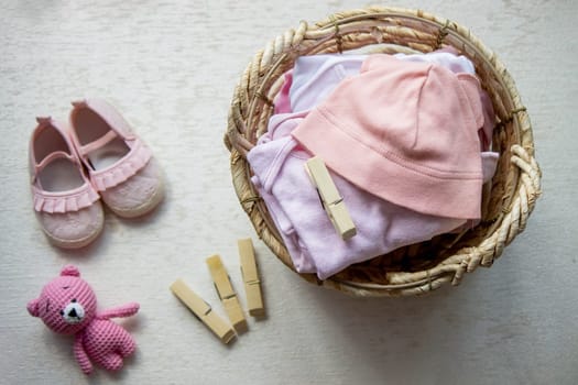 children's things in the basket. washing children's clothes