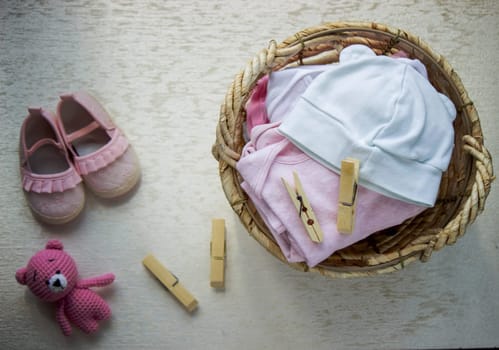 children's things in the basket. washing children's clothes