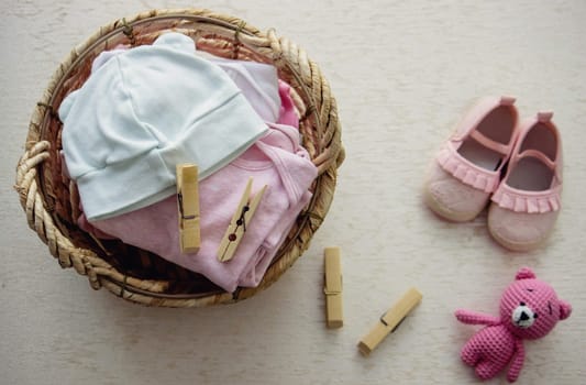 children's things in the basket. washing children's clothes