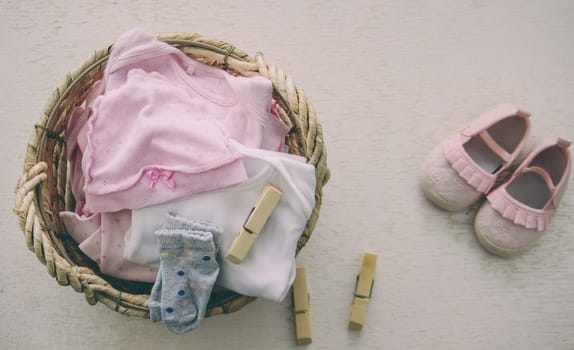 children's things in the basket. washing children's clothes