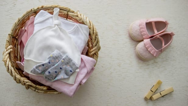 children's things in the basket. washing children's clothes