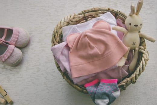 children's things in the basket. washing children's clothes