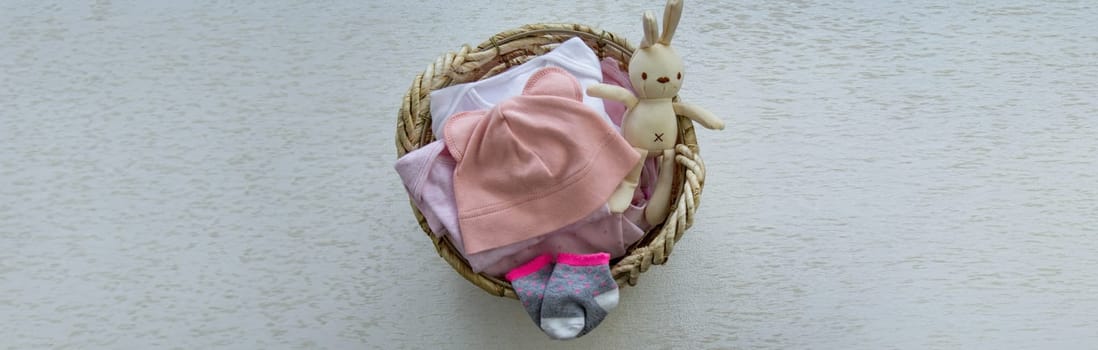 children's things in the basket. washing children's clothes