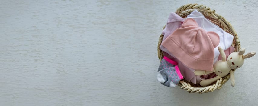 children's things in the basket. washing children's clothes