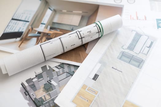 House construction plan concept. Tools for building work. Architectural model houses, yellow hard hat, meter and spirit level above blueprint with hammer, silicone gun, wrenches, headphones and gloves. High quality photo