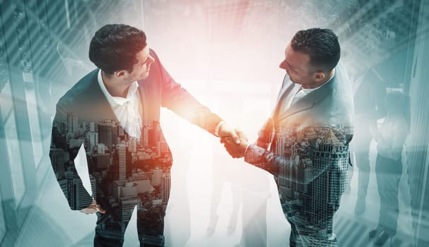 Double exposure image of business people handshake on city office building in background show partnership success of business deal. Concept of corporate teamwork, trust partner and work agreement. uds