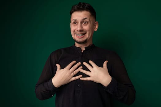 A man is seen forming a heart shape with his hands in this straightforward and heartwarming gesture. His fingers are positioned to create the recognizable symbol of love and affection.