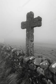 Celtic Cross Standing Solitary in a Misty Field, The cross melds into the morning mist, symbolizing faith and Celtic heritage.