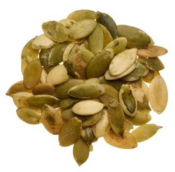 Heap of peeled pumpkin seeds on isolated background, top view