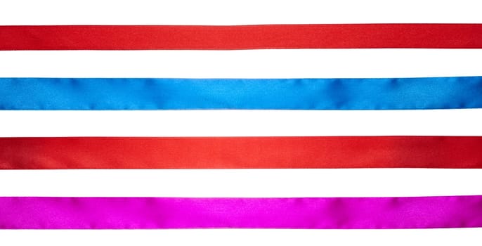 Red, blue and pink silk ribbons on isolated background