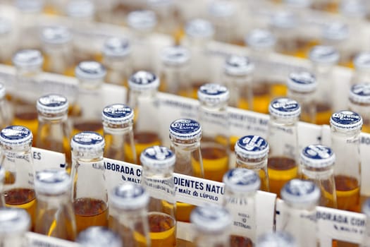 Corona Extra Beer sale, in beer boxes for 6 bottles, with handle. Pile of corona brand mexican beer boxes in a supermarket. Corona is the most popular imported beer in the USA. 20.02.2024, Armenia.