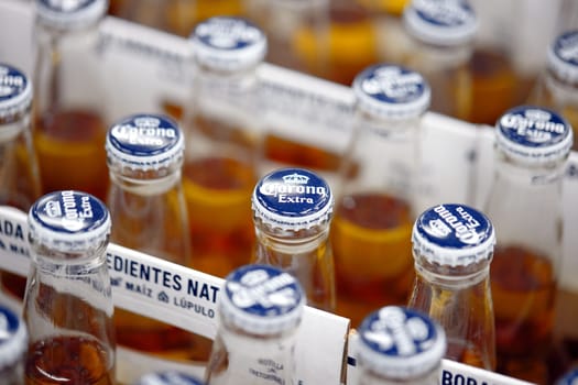 Corona Extra Beer sale, in beer boxes for 6 bottles, with handle. Pile of corona brand mexican beer boxes in a supermarket. Corona is the most popular imported beer in the USA. 20.02.2024, Armenia.