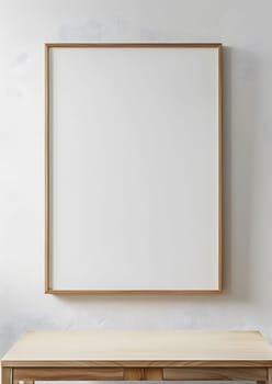 A rectangular picture frame is hanging on a whiteboard above a hardwood table in a room. The frame is made of plywood, adding an artistic touch to the space