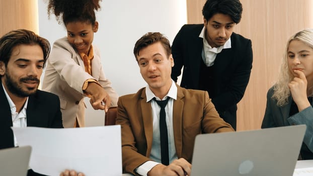 Diverse office worker employee working and brainstorm on strategic business marketing planning. Teamwork and positive attitude create productive and supportive in ornamented business office workplace.