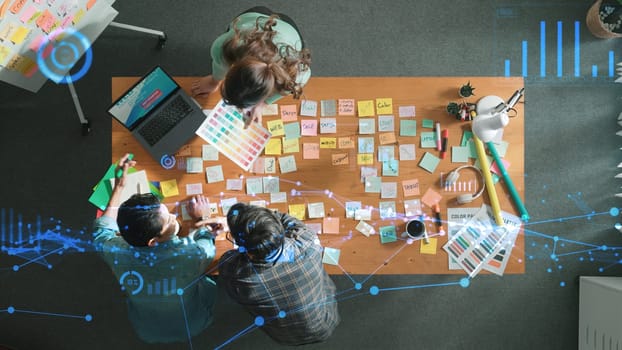 Top down view of smart designer explain and brainstorming idea for financial chart or stock market statistic. Aerial view of business people discuss and talking while using sticky notes. Symposium.