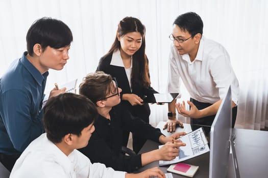 Group of diverse office worker employee working together on strategic business marketing planning in corporate office room. Positive teamwork in business workplace concept. Prudent