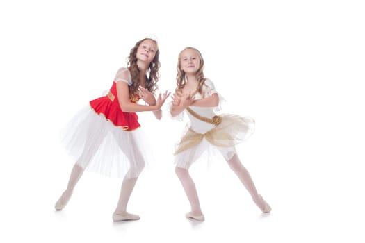 Two adorable ballet dancers, isolated on white background