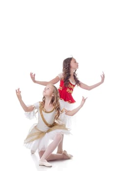 Duo of young artistic ballet dancers, isolated on white backdrop