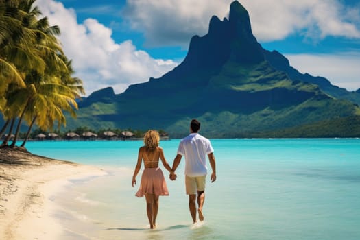 A couple on a tropical island strolling along the beach.