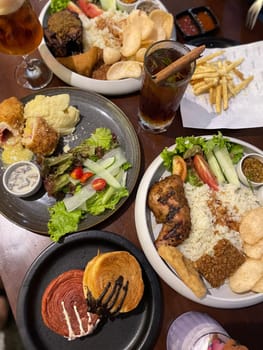 Nasi uduk ayam bakar, or coconut milk flavor rice served with grilled chicken, fresh salad, and chili paste traditional Indonesian food, indonesian street food, homemade food