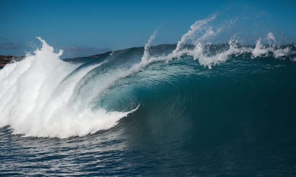 Ocean wave breaking on the shore. Ocean wave breaking on the beach.