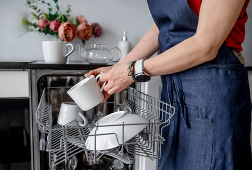 Girl Retrieves Clean Cup From Dishwasher, Clean Dishes