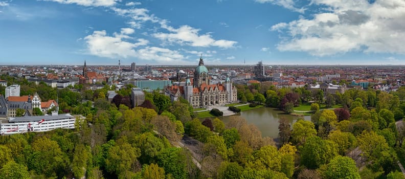 Aerial view of historic new town hall of Hanover and city centre in the background, Germany