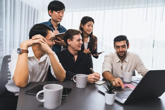 Group of diverse office worker employee working together on strategic business marketing planning in corporate office room. Positive teamwork in business workplace concept. Prudent