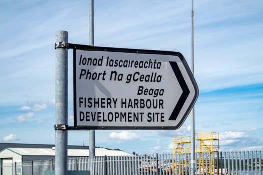 KILLYBEGS, IRELAND - MAY 16 2023: The sign at the roundabout is showing the way to the harbour.