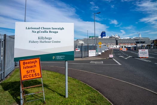 KILLYBEGS, IRELAND - MAY 16 2023: The sign at the roundabout is showing the way to the harbour.