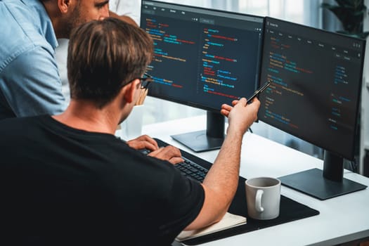 IT developers discussing online software development information on pc screen, creating program coding for latest version application on website. Concept of brainstorming firmware updated. Sellable.