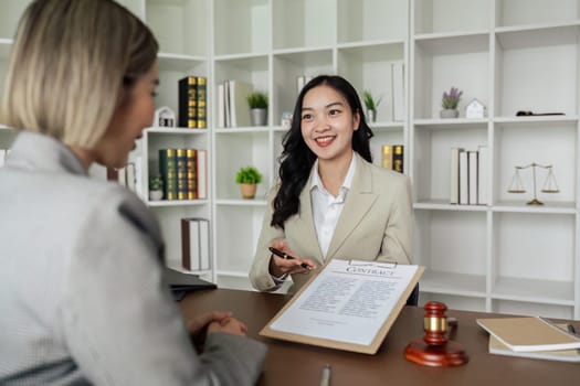 Lawyers provide advice to client are business partner. Lawyer working with client discussing contract document in office, consulting to help customer.