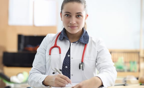 Female doctor with stethoscope fills out document. Doctor will prescribe specific treatment for patient. Neurological and psychological disorders. Make an appointment with doctor