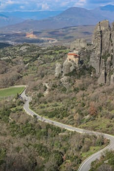 Discover serenity amidst the grandeur of Meteora's towering cliffs, where the smallest of churches offers a tranquil retreat amidst breathtaking natural beauty