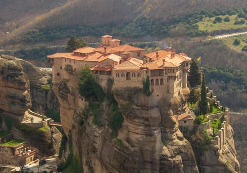 Experience the divine tranquility and architectural marvels of Monastery Varlaam, nestled amidst the majestic cliffs of Meteora, Greece