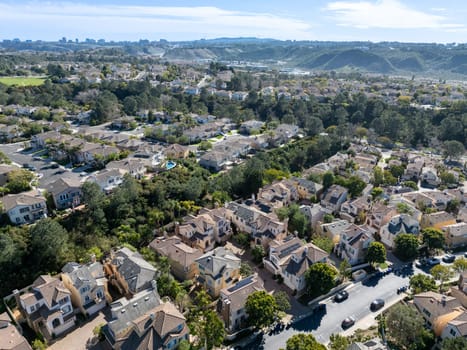 Aerial view of middle class subdivision neighborhood with residential condos and houses in San Diego, California, USA.