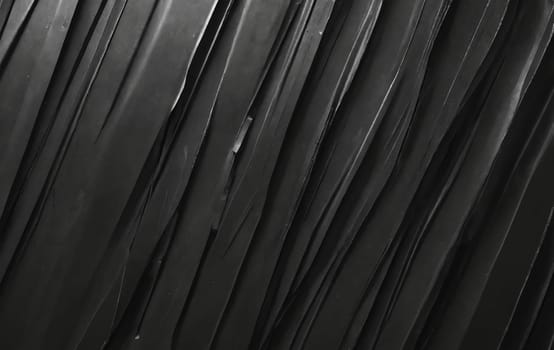 A detailed image of a black feather texture against a black background, resembling tints and shades commonly found in automotive tires and flooring materials made of synthetic rubber