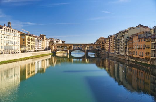 Florence, Italy - 12.02.2023: View of the famous Ponte alle Grazie bridge and the Arno river in Florence. High quality photo