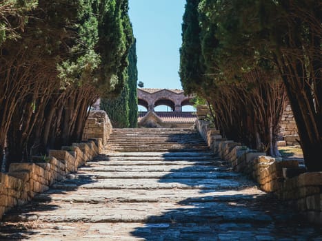 Beautiful view of the ancient stone stairs leading up to the temple of the virgin on Mount Filerimos in Greece on the island of Rhodes, close-up view from below. Concept of historical buildings.