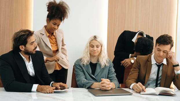 Diverse office worker employee working and brainstorm on strategic business marketing planning. Teamwork and positive attitude create productive and supportive in ornamented business office workplace.