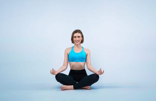 Full body length gaiety shot athletic and sporty woman doing healthy and meditative yoga exercise workout posture on isolated background. Healthy active and body care lifestyle