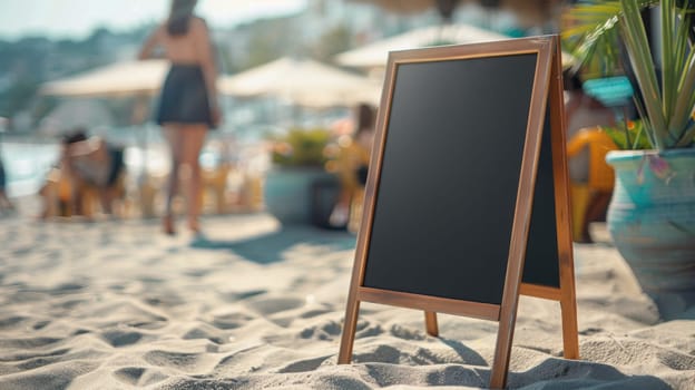 A blackboard is on a wooden stand on a beach.