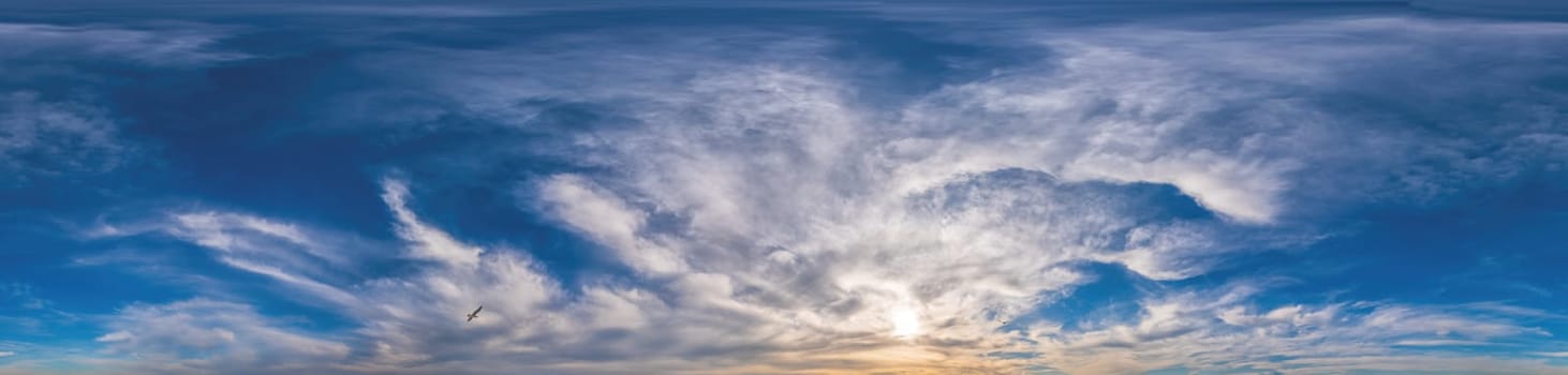 Sunset sky panorama with Cirrus clouds in Seamless spherical equirectangular format. Complete zenith for use in 3D graphics, game and for composites in aerial drone 360 degree panoramas as a sky dome.