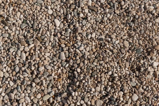 Pebbles on the seashore, close-up. Natural background