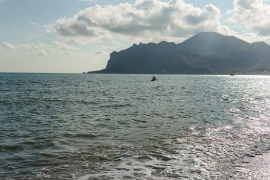 Beach Relaxation at the Black Sea. Fairy-tale Moments of a Sunny Day. The concept of tourism and sea travel.