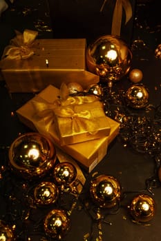 Golden gift boxes on the background of golden balloons