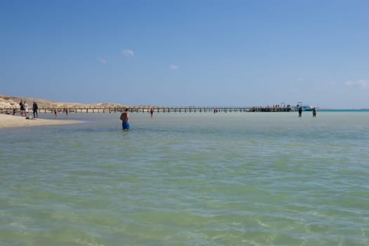 Beach Relaxation at the Red Sea. Fairy-tale Moments of a Sunny Day. The concept of tourism and sea travel.