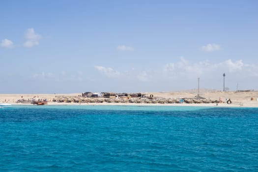 Beach Relaxation at the Red Sea. Fairy-tale Moments of a Sunny Day. The concept of tourism and sea travel.