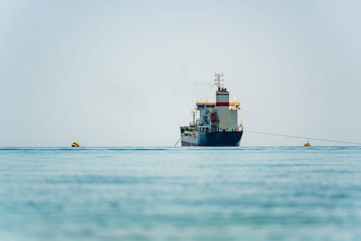 Oil chemical tanker anchored in the Mediterranean sea on a cloudy day